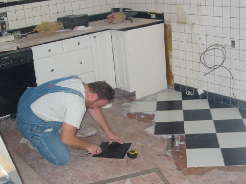 George cutting tile for the kitcien floor
